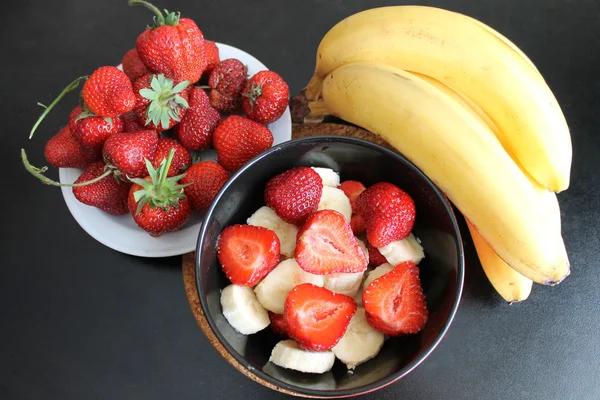 Erdbeere mit Banane Stockbild