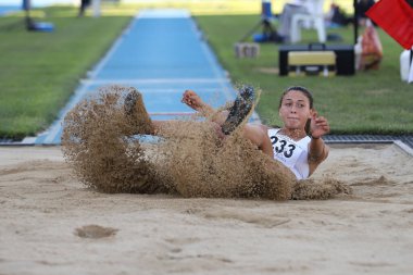 ISTANBUL, TURKEY - AUGUST 08, 2021: Undefined athlete long jumping during Turkish Athletic Federation Olympic Threshold Competitions