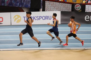İSTANBUL, TURKEY - 11 Aralık 2021: Türkiye Atletizm Federasyonu Olimpiyat Eşiği sırasında koşan sporcular
