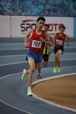ISTANBUL, TURKEY - FEBRUARY 19, 2022: Athletes running during Turkey Olympic Preparation Center Athletes Indoor Festival in Atakoy Athletics Arena