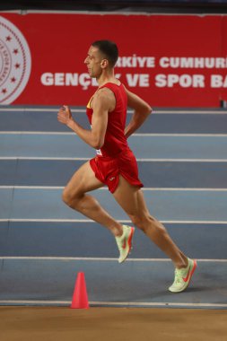 ISTANBUL, TURKEY - MARCH 05, 2022: Undefined athlete running during Balkan Athletics Indoor Championships in Atakoy Athletics Arena