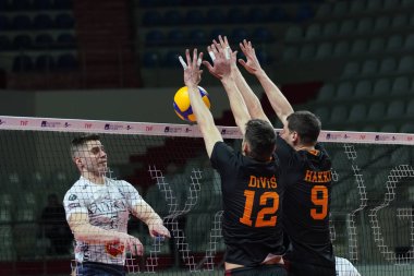 ISTANBUL, TURKEY - MARCH 26, 2022: Lukas Divis and Hakki Capkinoglu in action during Galatasaray vs Altekma SK Turkish Mens Volleyball League match in Burhan Felek Sport Hall