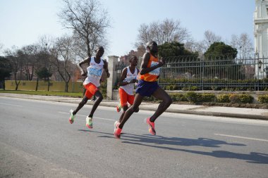 ISTANBUL, TURKEY - NOVEMBER 07, 2021: Athletes running Istanbul half marathon in historic street of Fener district