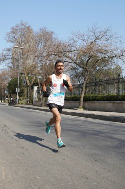 ISTANBUL, TURKEY - NOVEMBER 07, 2021: Athletes running Istanbul half marathon in historic street of Fener district