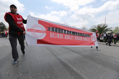 ISTANBUL, TURKEY - MAY 01, 2022: People march in International Workers Day