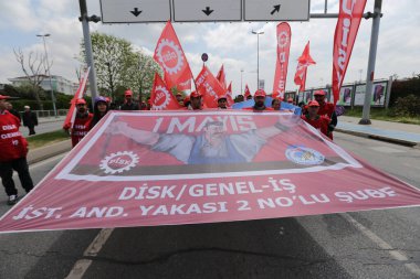 ISTANBUL, TURKEY - MAY 01, 2022: People march in International Workers Day