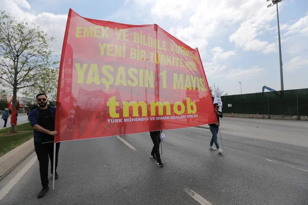 ISTANBUL, TURKEY - MAY 01, 2022: People march in International Workers Day