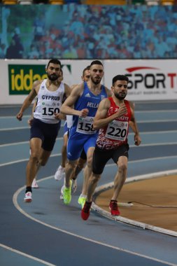 ISTANBUL, TURKEY - MARCH 05, 2022: Athletes running during Balkan Athletics Indoor Championships in Atakoy Athletics Arena