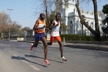 ISTANBUL, TURKEY - NOVEMBER 07, 2021: Athletes running Istanbul half marathon in historic street of Fener district