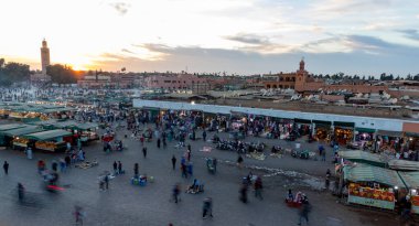 MARRAKESH, MOROCCO - NOVEMBER 02, 2021: People in Jemaa el-Fnaa where main square of Marrakesh, used by locals and tourists