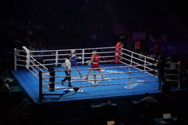 ISTANBUL, TURKEY - MAY 19, 2022: Lin Yu-Ting (Red) and Testa Irma (Blue) compete during IBA Womens World Boxing Championships