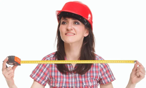 Woman in helmet holding a tape measure — Stock Photo, Image