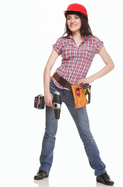 Giovane donna costruttore con un trapano — Foto Stock