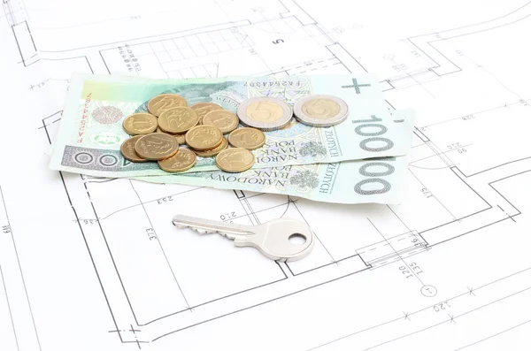 Money and silver key lying on the housing plan — Stock Photo, Image