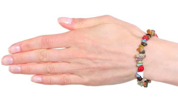 Hand van vrouw met armbanden op witte achtergrond — Stockfoto