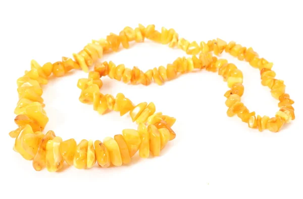 Orange, shiny amber necklace for the woman on white background — Stock Photo, Image