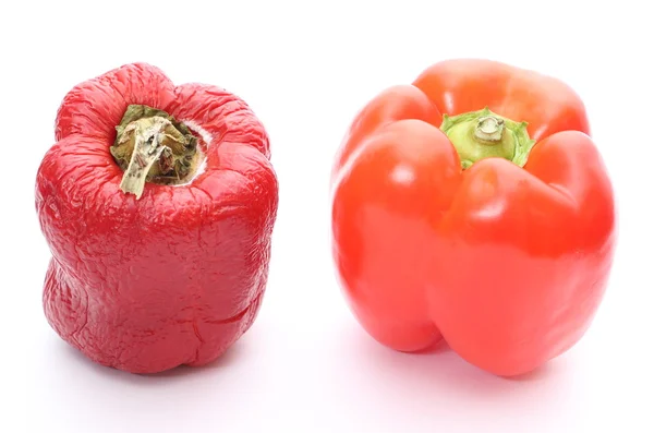 Fresh and wrinkled peppers on white background — Stock Photo, Image