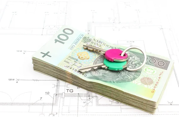 Money with keys lying on the housing plan — Stock Photo, Image