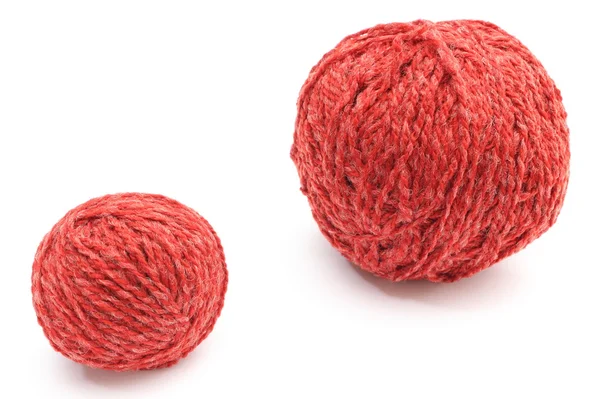 Closeup of small and big red wool ball. White background — Stock Photo, Image