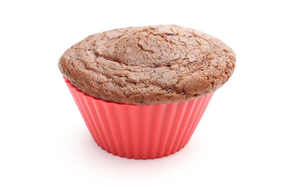 Fresh baked chocolate muffin in red silicone cup