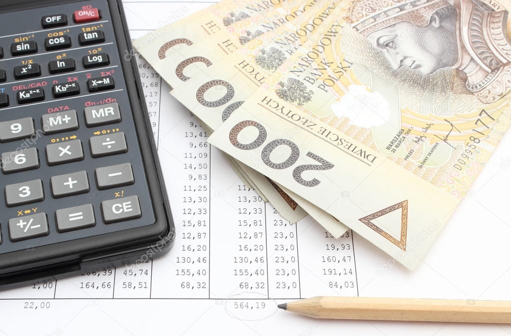 Money, pencil and calculator lying on spreadsheet