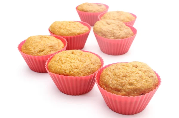 Fresh baked carrot muffins in red silicone cups — Stock Photo, Image