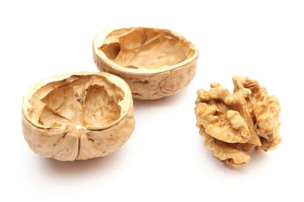 Walnut without shell and nutshells on white background — Stock Photo, Image