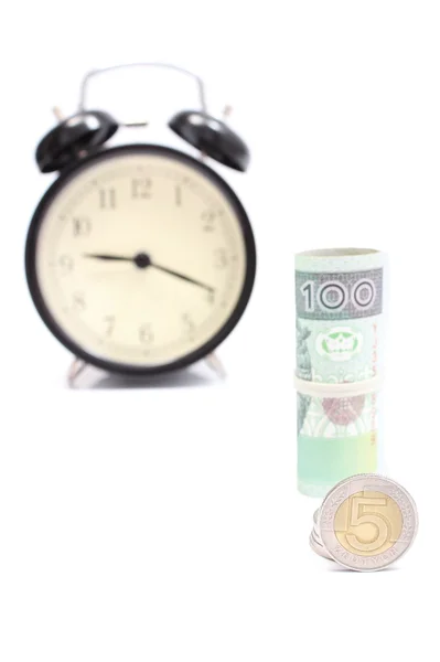 Roll of tied banknotes and coins with retro styled alarm clock — Stock Photo, Image