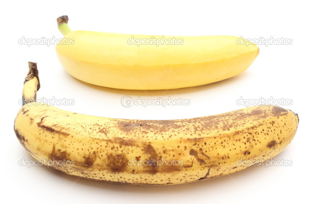 Fresh and overripe bananas on white background