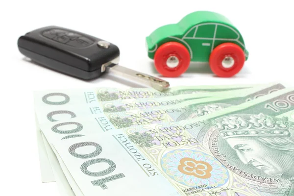 Money, wooden green toy car and key vehicle. White background — Stock Photo, Image