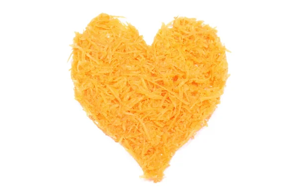 Heart shaped grated carrots on white background — Stock Photo, Image
