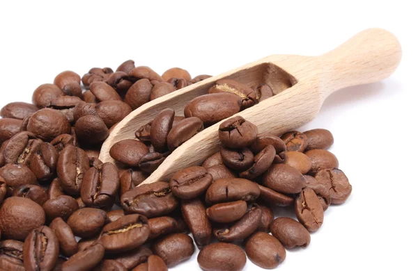 Heap of coffee on wooden spoon. White background — Stock Photo, Image