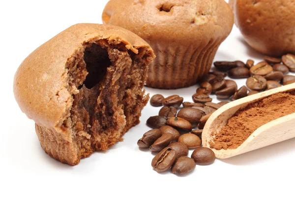 Fresh baked muffins, coffee grains and powdery cinnamon — Stock Photo, Image