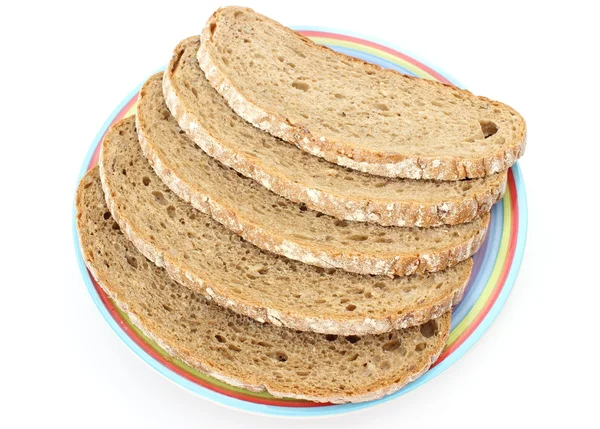 Кусочки ржаного хлеба и разноцветная тарелка — стоковое фото