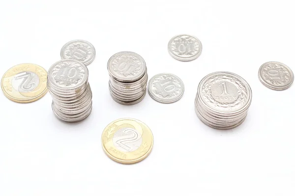 Mynt på vit bakgrund — Stockfoto