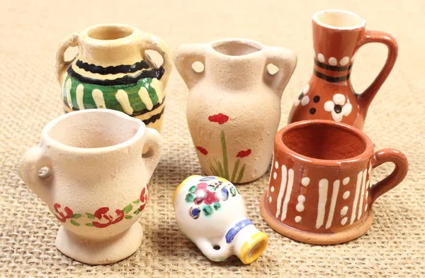 Decorative ceramic vases on jute canvas — Stock Photo, Image