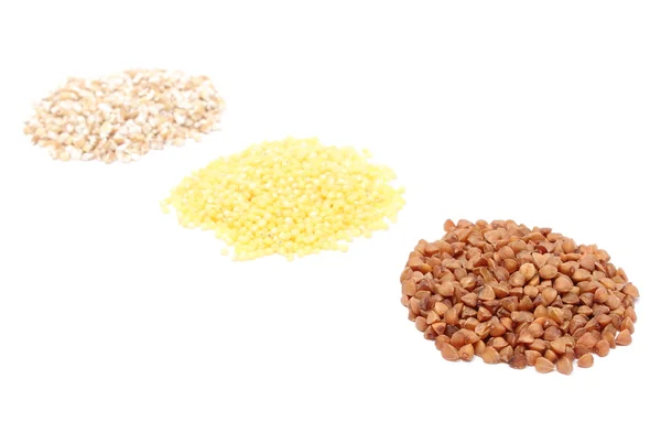 Heap of buckwheat, millet and barley groats. White background — Stock Photo, Image