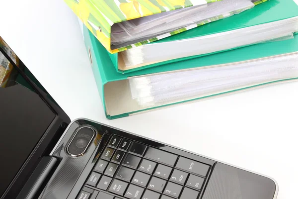 Laptop and file folders on white background — Stock Photo, Image