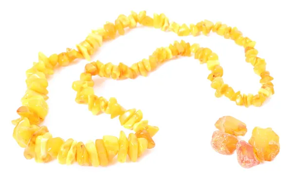 Orange, shiny necklace for the woman with raw amber — Stock Photo, Image