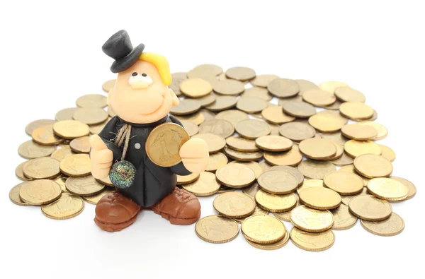 Chimney sweep on a pile of coins. Isolated on white — Stock Photo, Image