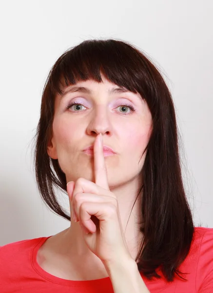 Žena ukazující ruka mlčení znamení — Stock fotografie
