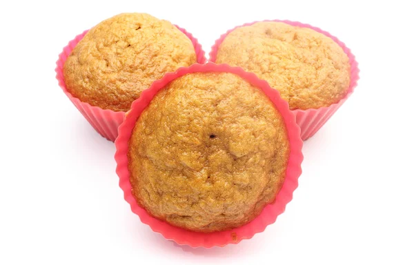 Fresh baked carrot muffins in red silicone cups — Stock Photo, Image