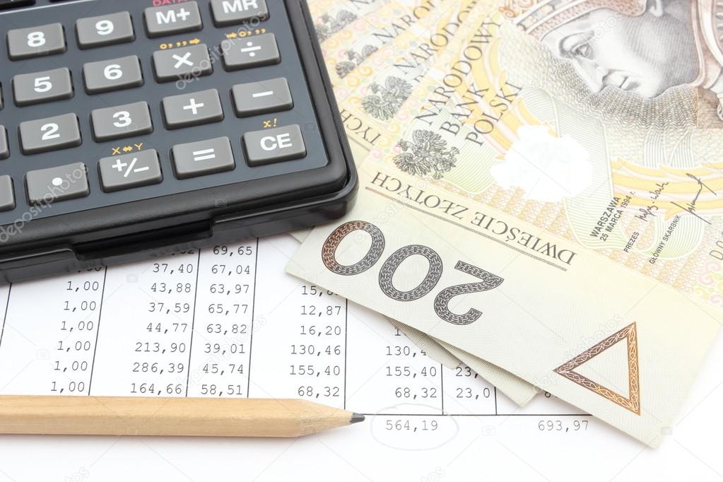 Money, pencil and calculator lying on spreadsheet