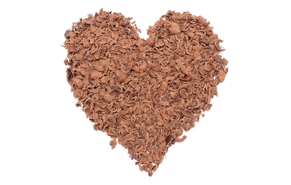 Valentine heart of grated chocolate on white background — Stock Photo, Image