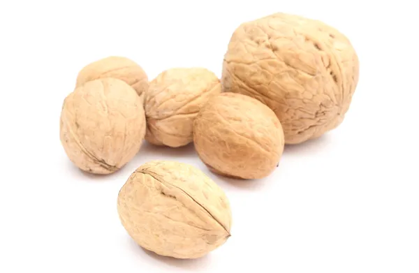 Brown and fresh walnuts on white background — Stock Photo, Image