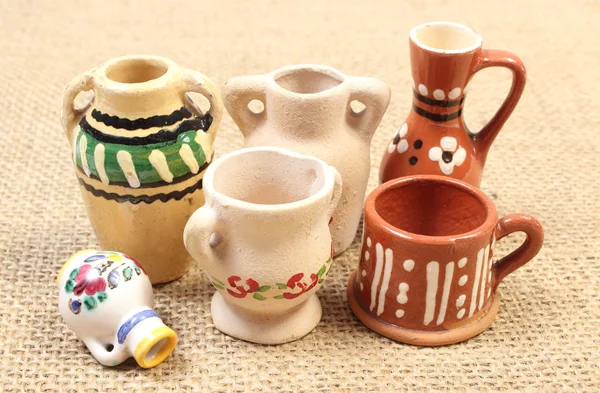 Decorative ceramic vases on jute canvas — Stock Photo, Image