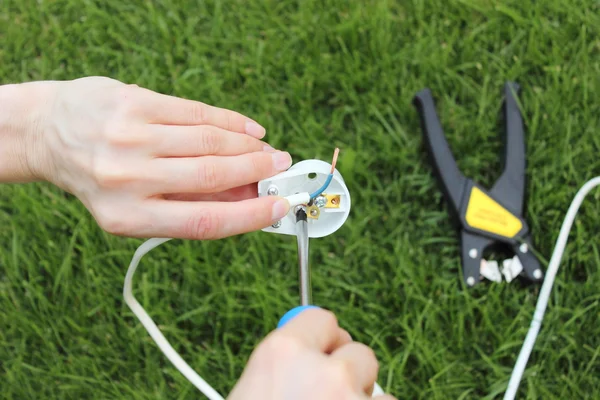 Electrician installing a power plug — Stock Photo, Image