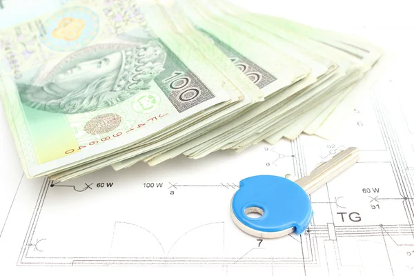 Stack of money with key lying on the housing plan — Stock Photo, Image