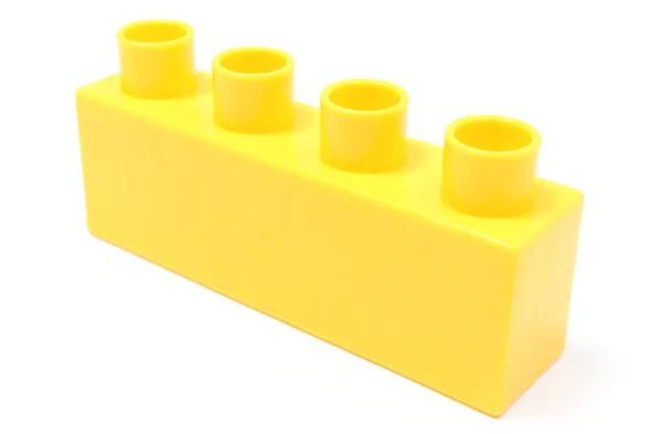 Yellow building block on white background — Stock Photo, Image