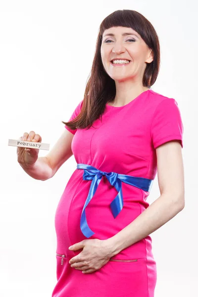 Glad Leende Gravid Kvinna Rosa Klänning Med Blått Band Visar — Stockfoto